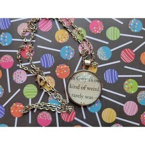 Kind of Weird pendant necklace made from The Kiss Curse book pages